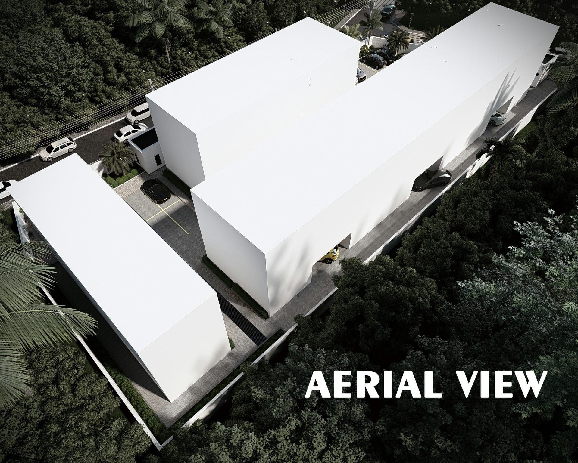Aerial view over Ewang Estate showing the apartment blocks and terrace row arranged around the internal driveway and parking court.